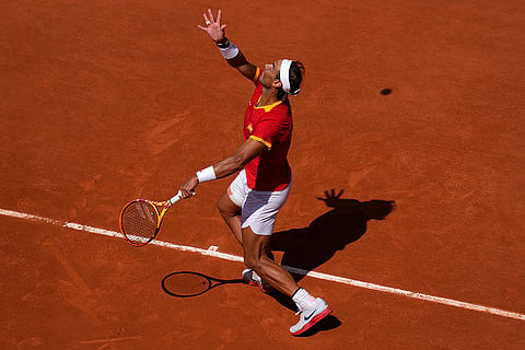 Rafael Nadal serves the ball to Novak Djokovic